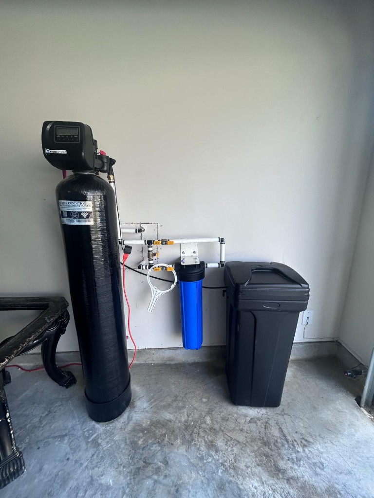 Completed softener, pre-filter, and brine tank installation